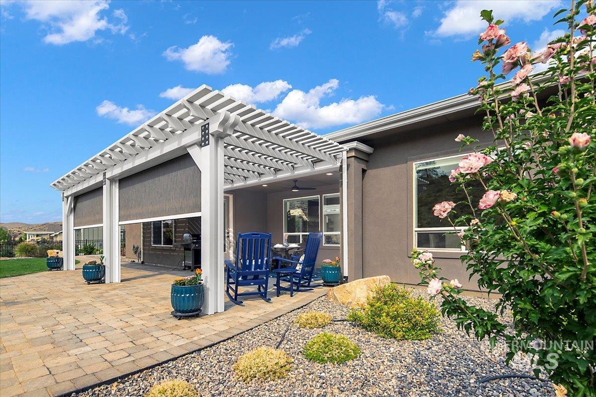 View of patio with a pergola, ceiling fan, and grilling area