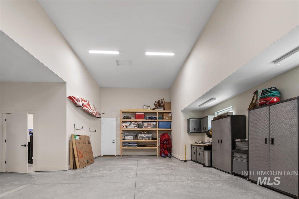 Garage featuring baseboards