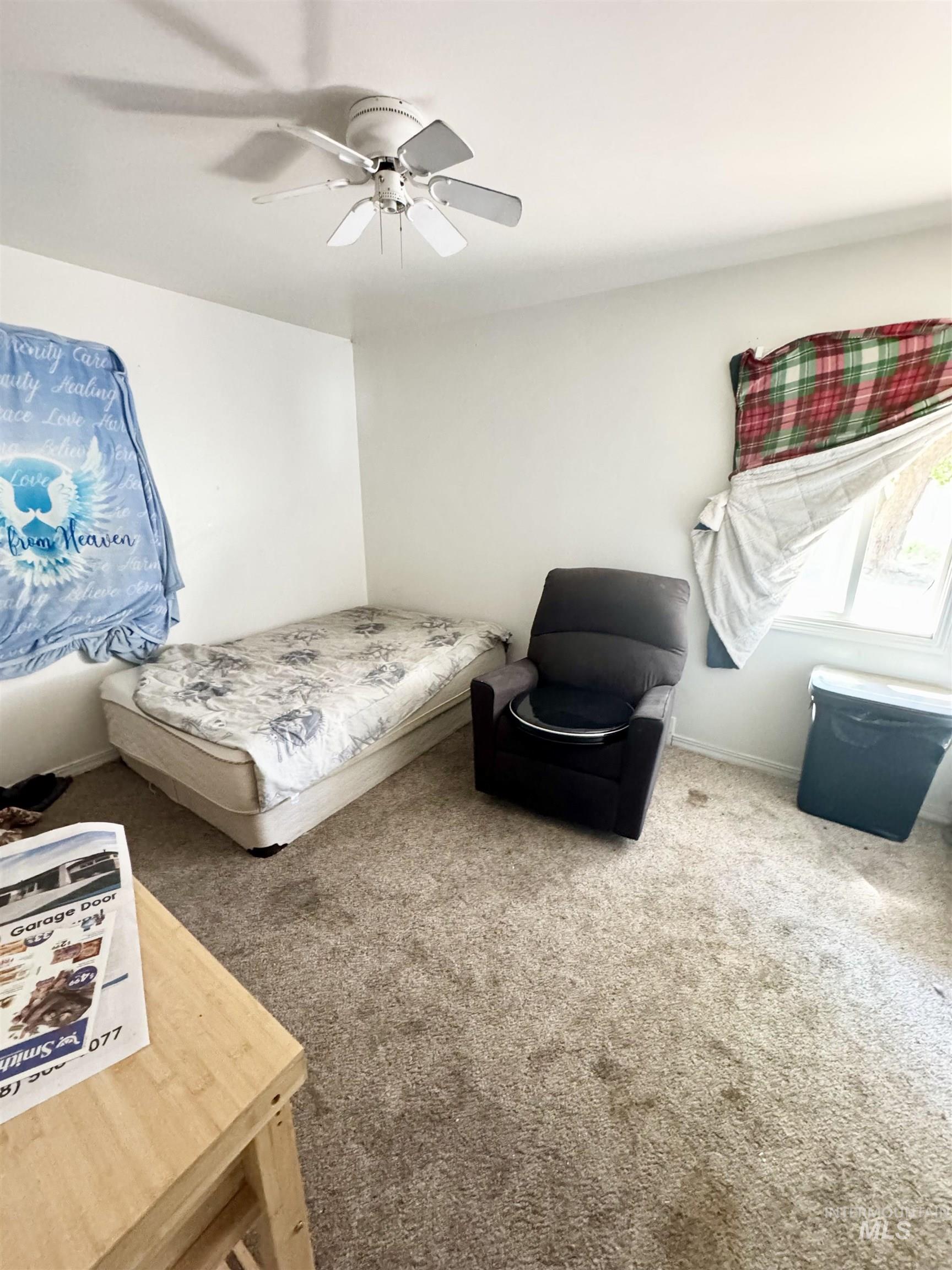 Bedroom featuring carpet and ceiling fan