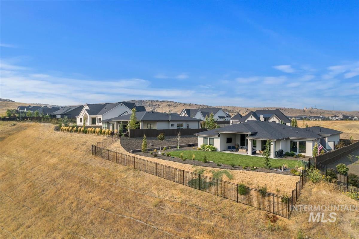 Rear view of house with a patio and a fenced backyard