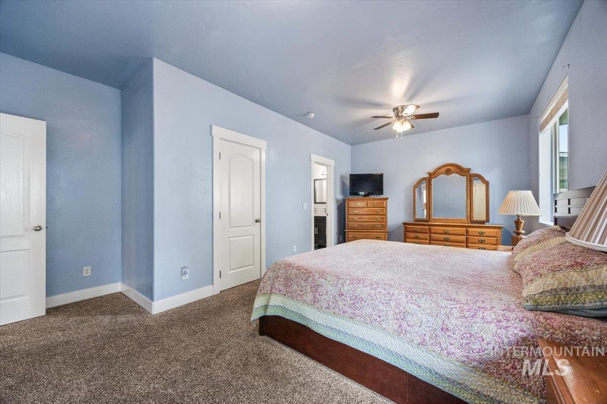 Bedroom with carpet and ceiling fan