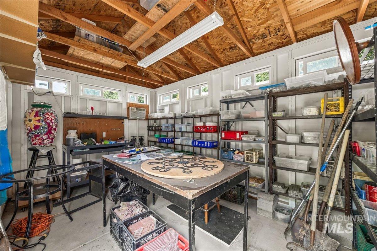 Playroom featuring healthy amount of natural light and concrete floors