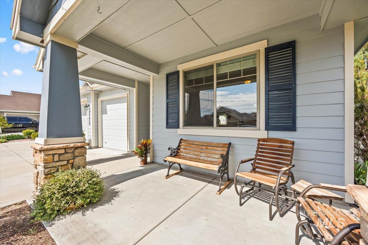 Porch with a garage and driveway