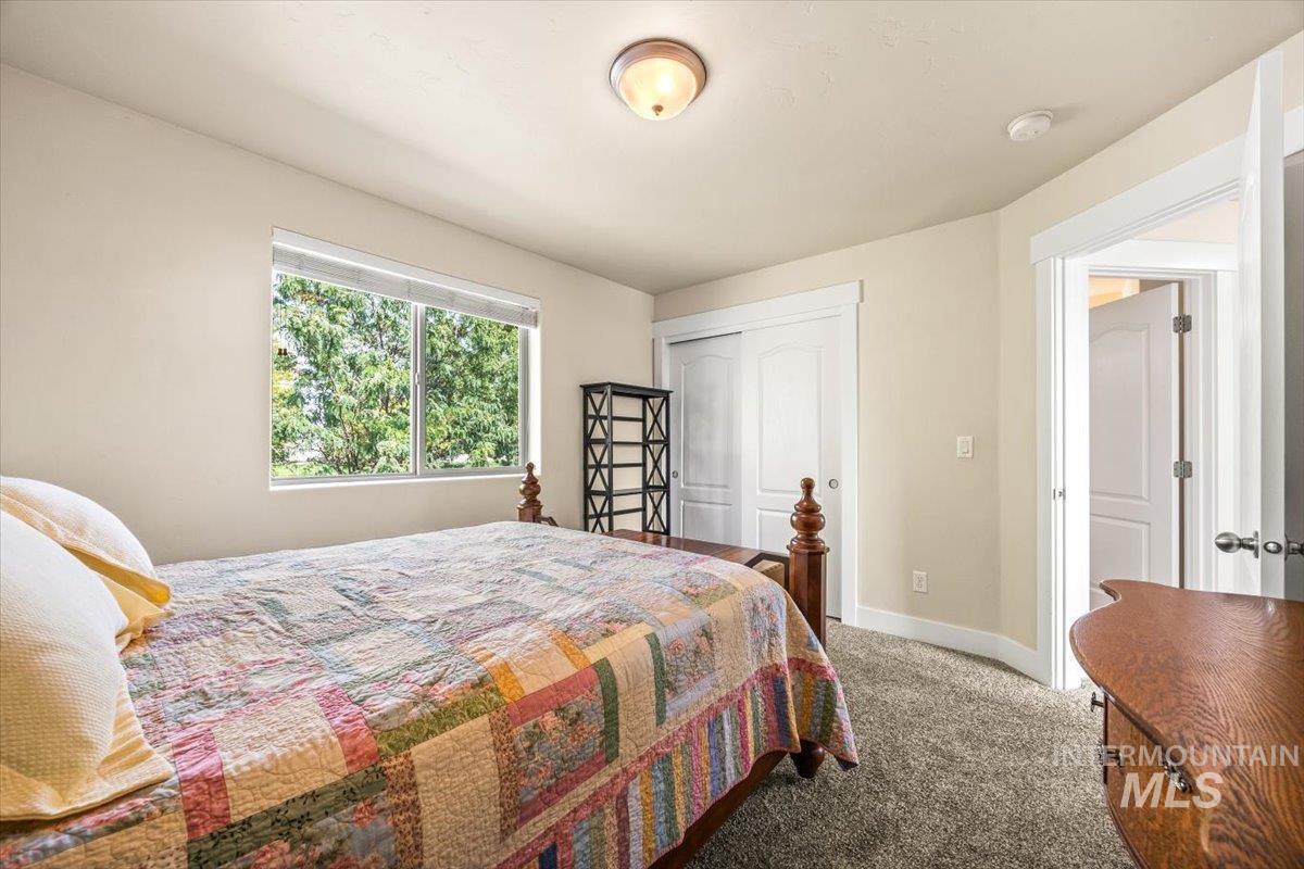 Bedroom featuring carpet floors and a closet