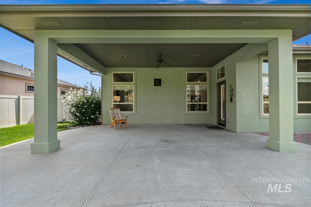 View of patio with a ceiling fan