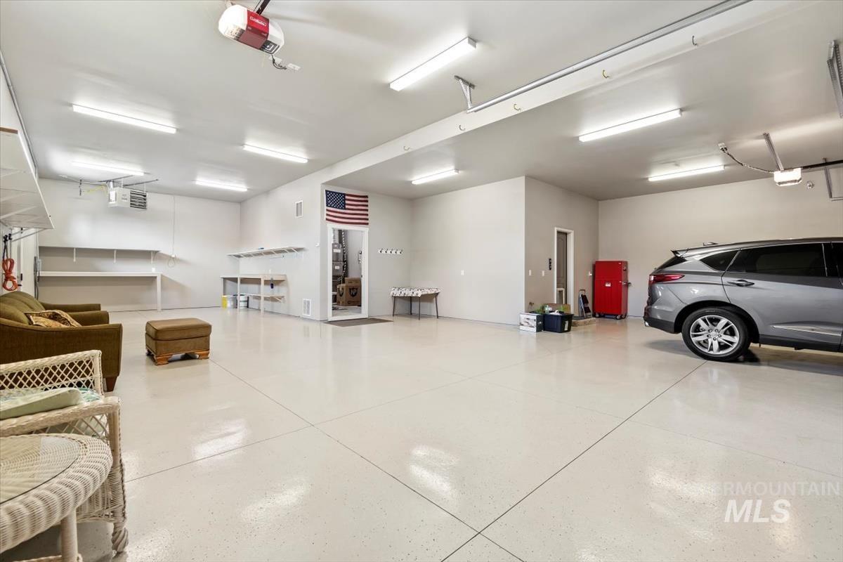 Garage featuring a garage door opener