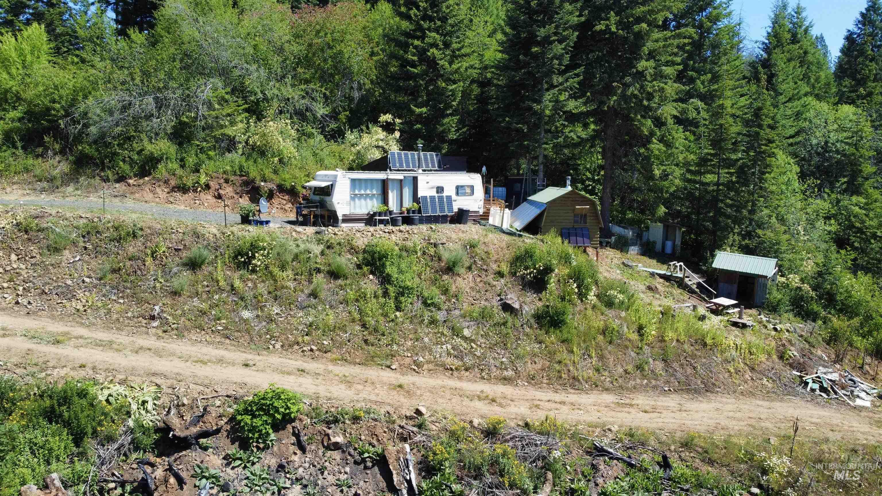View from above of property featuring a forest