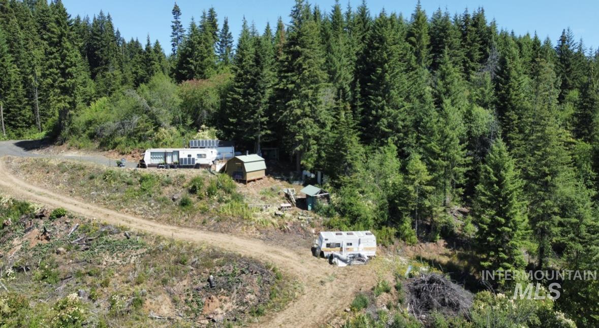 View of property location featuring a heavily wooded area