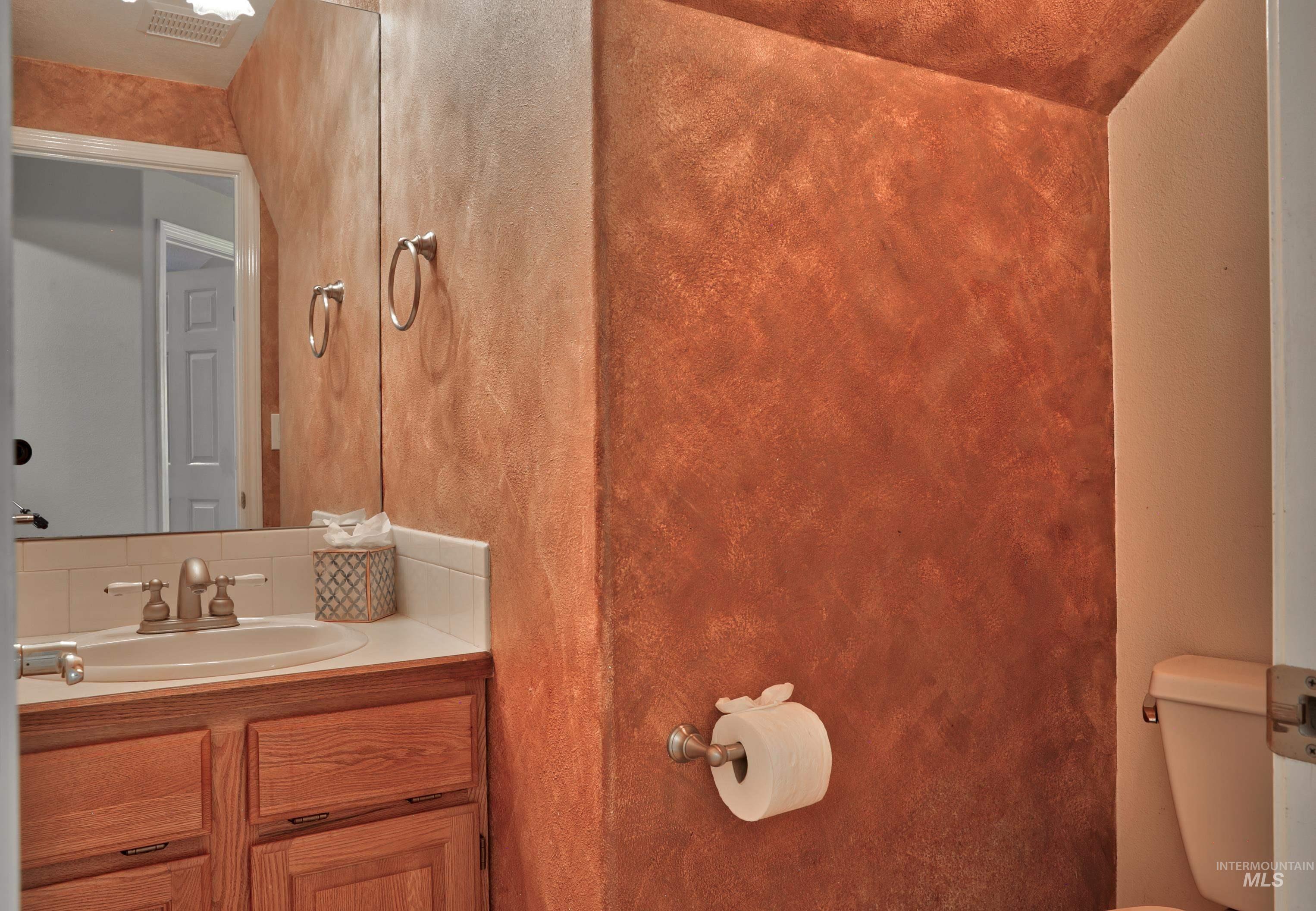 Bathroom featuring toilet and vanity