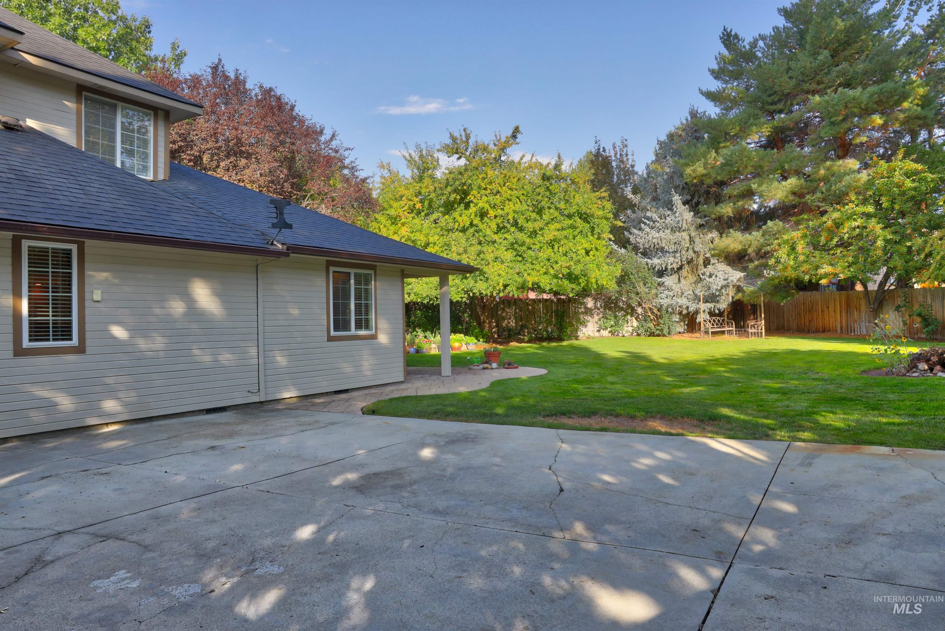 Fenced backyard featuring a patio