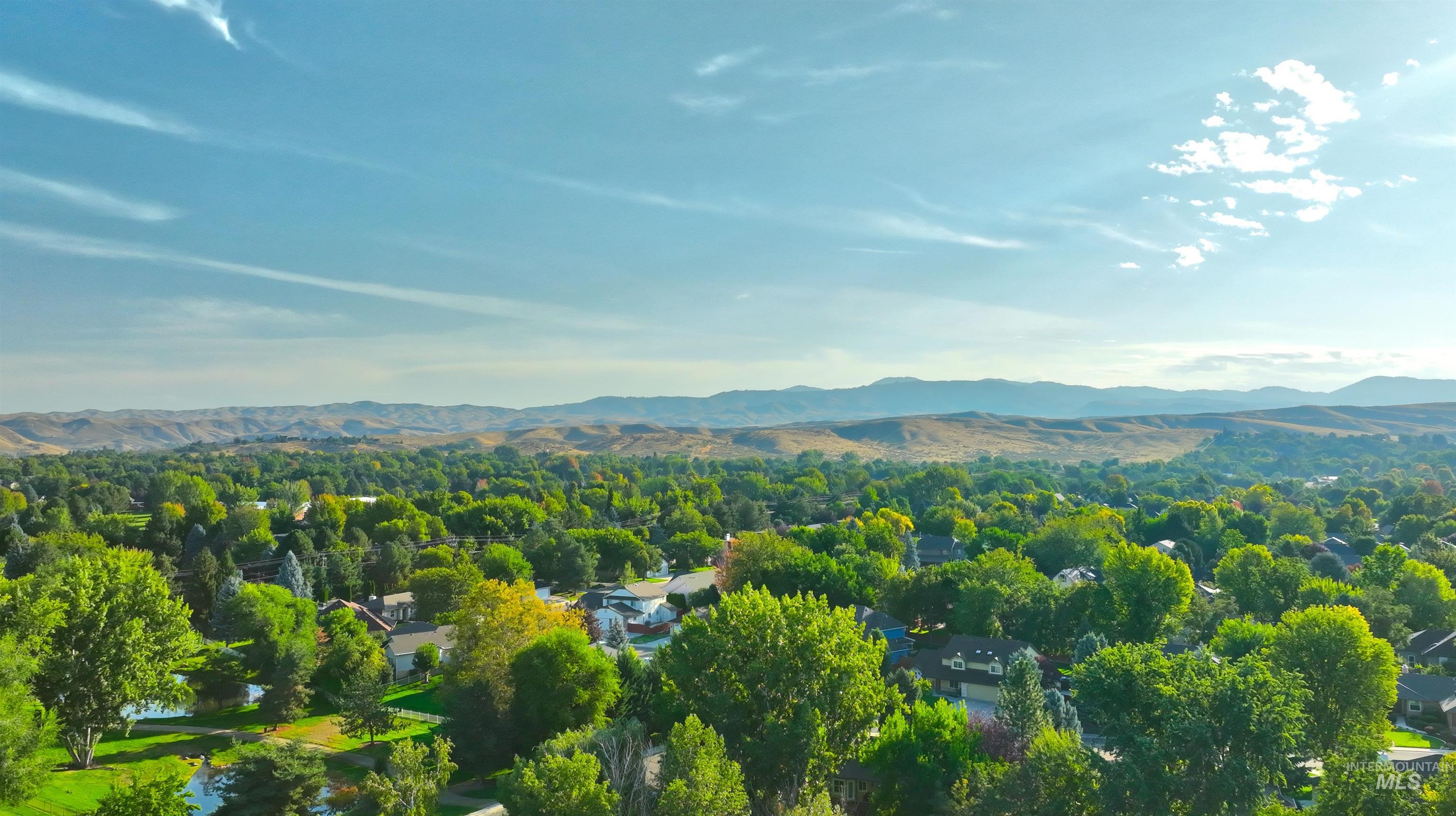 Drone / aerial view of mountains and a heavily wooded area