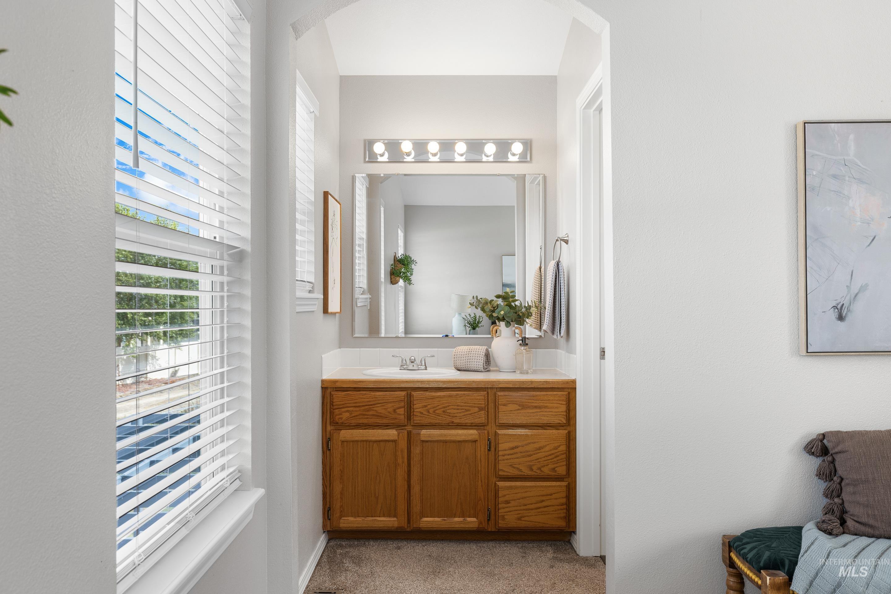 Bathroom with vanity and plenty of natural light