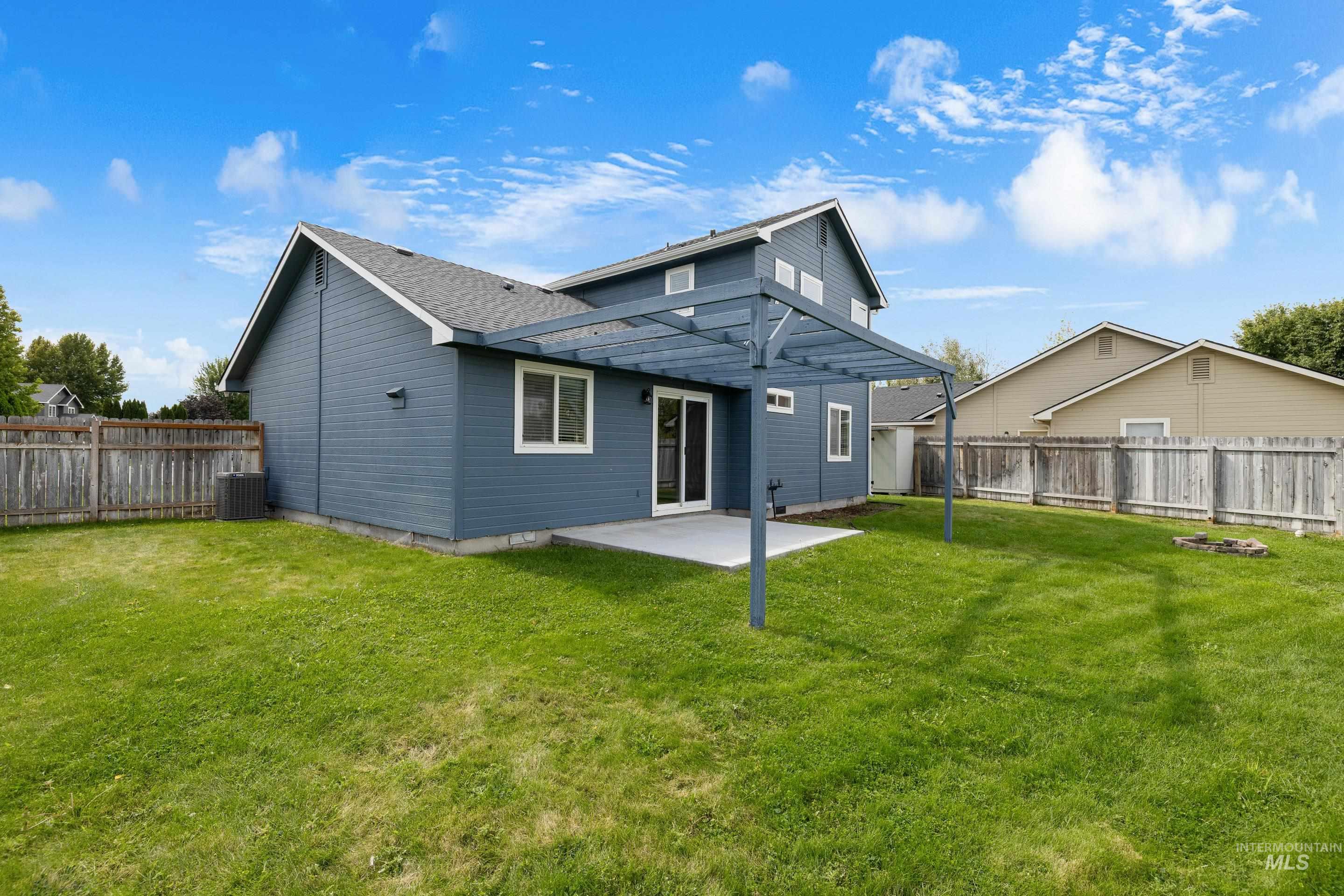 Back of house with a patio and a fenced backyard