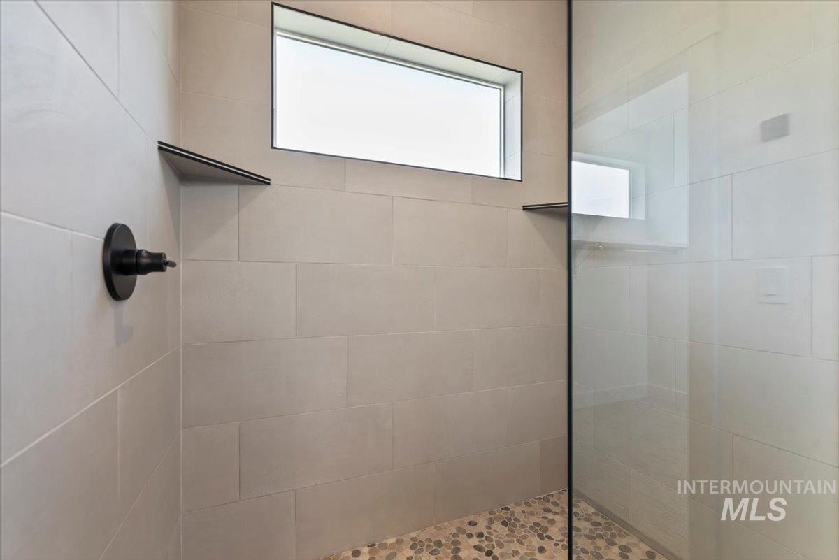 Bathroom featuring walk in shower