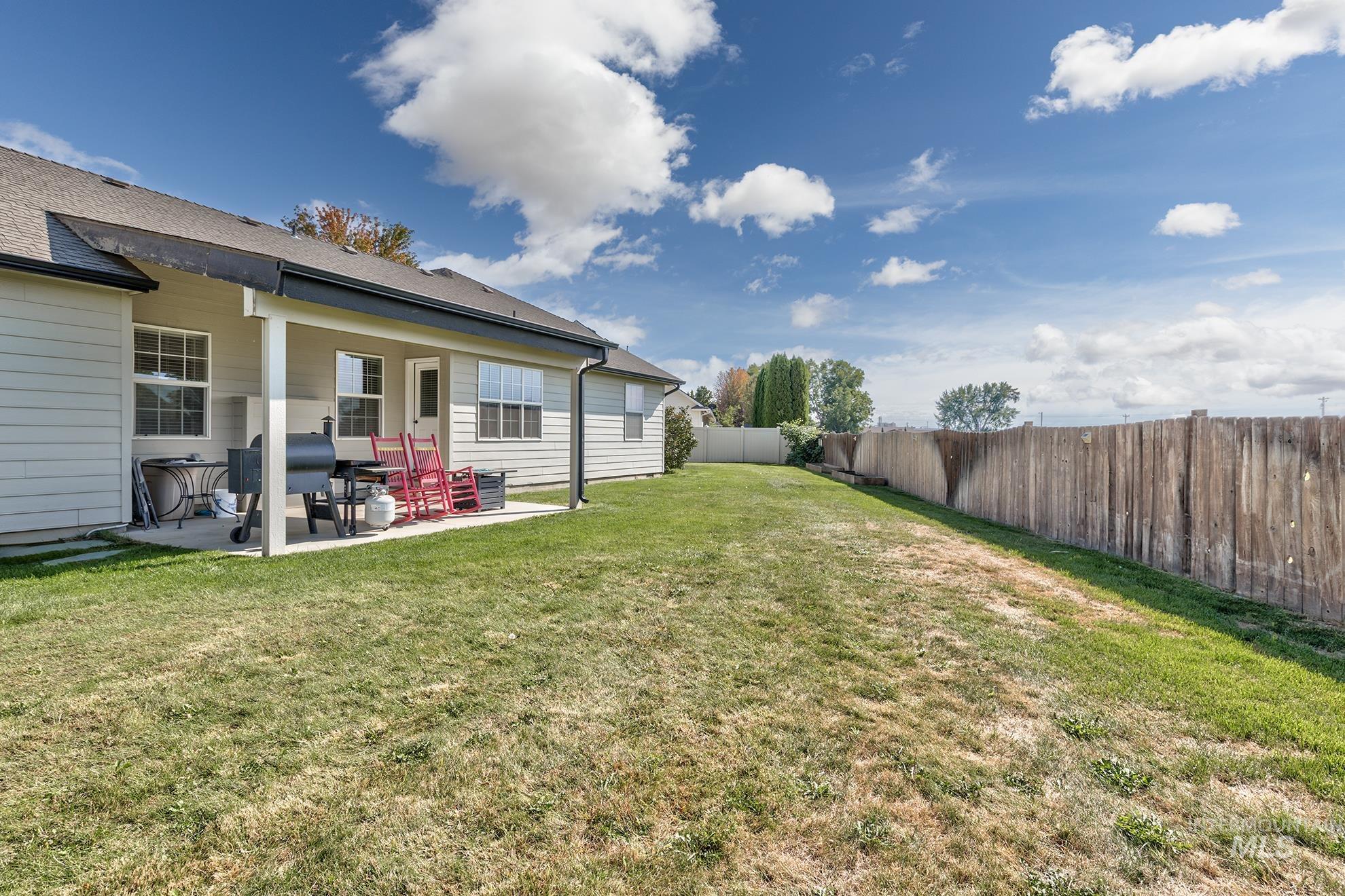 Fenced backyard featuring a patio area