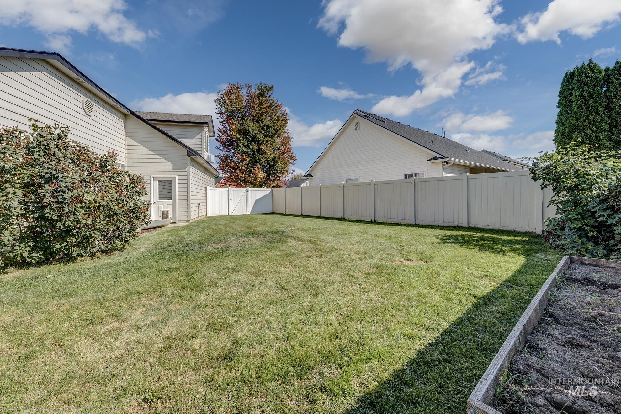 View of fenced backyard