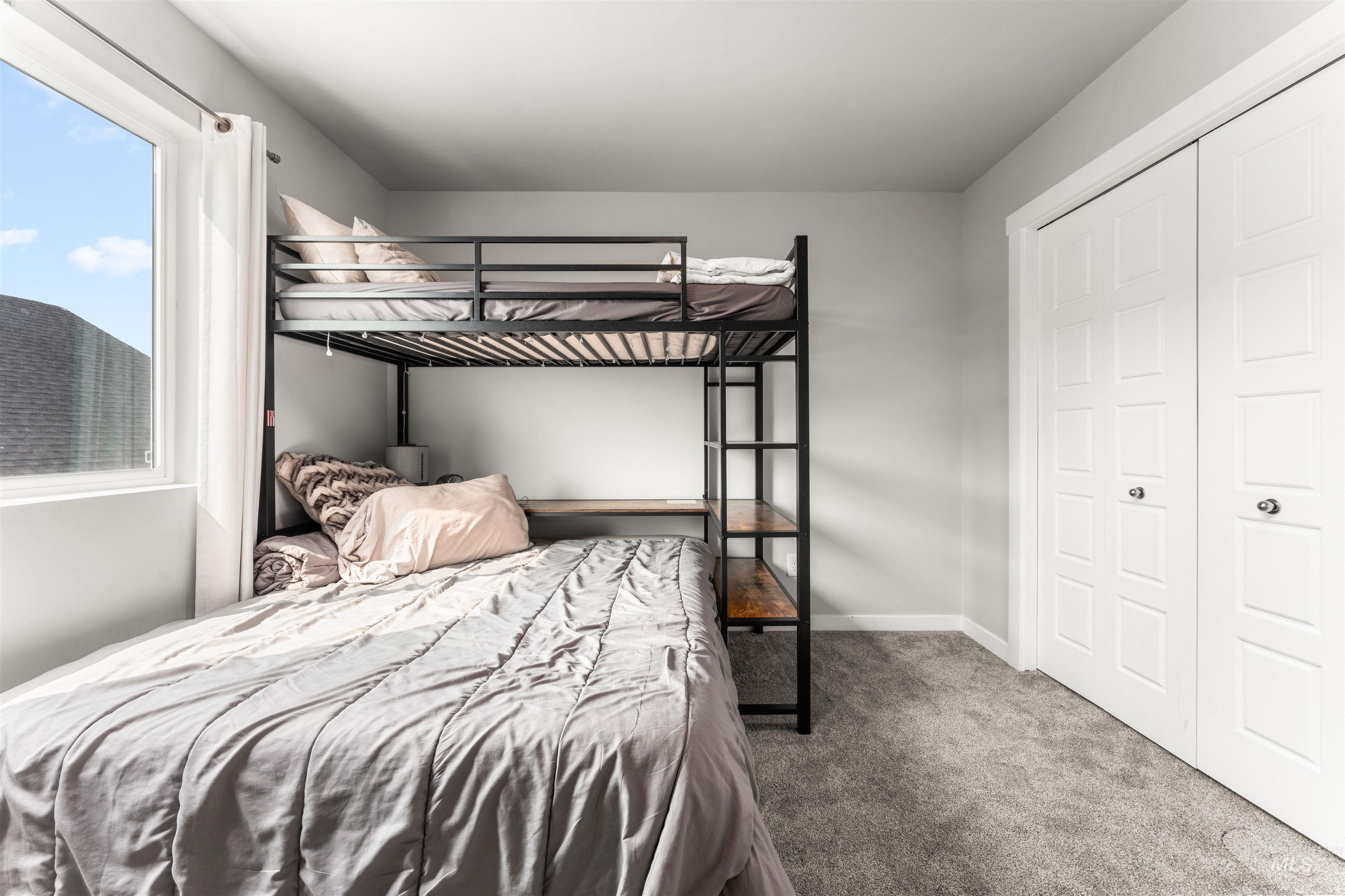 Bedroom with carpet and baseboards