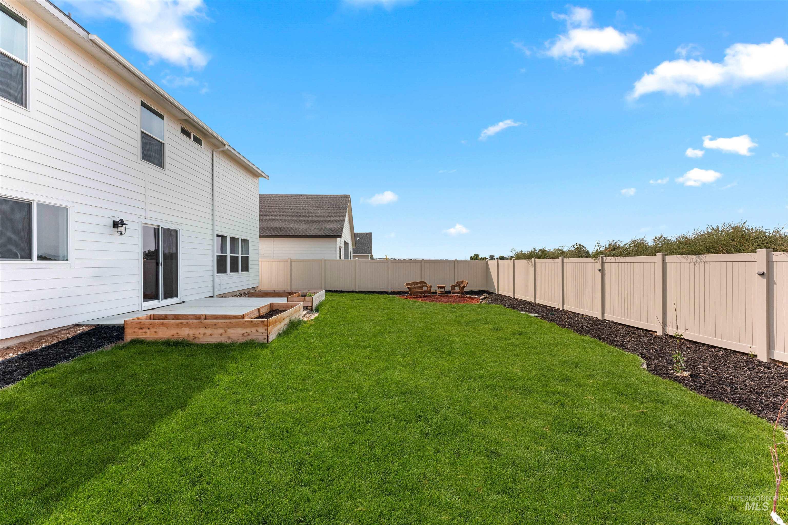 View of fenced backyard