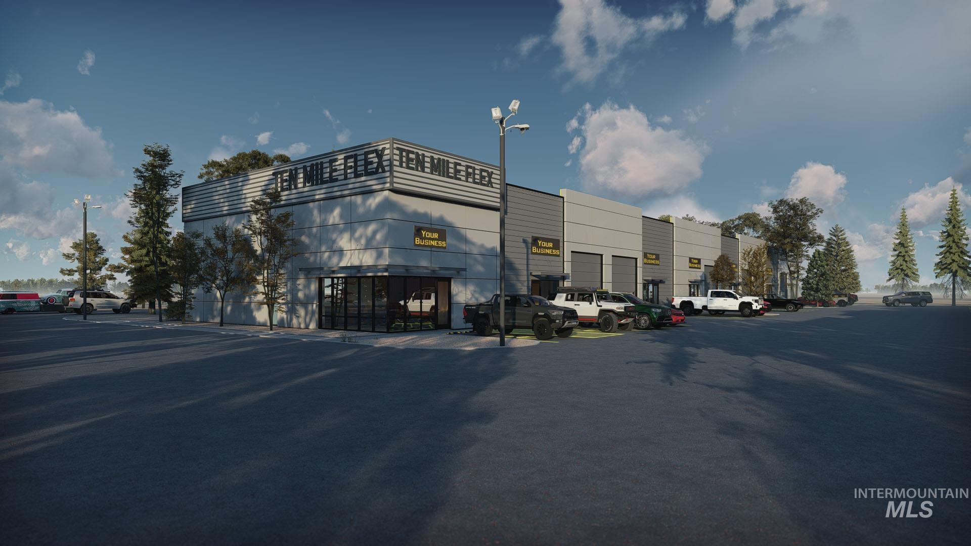 View of commercial property featuring uncovered parking
