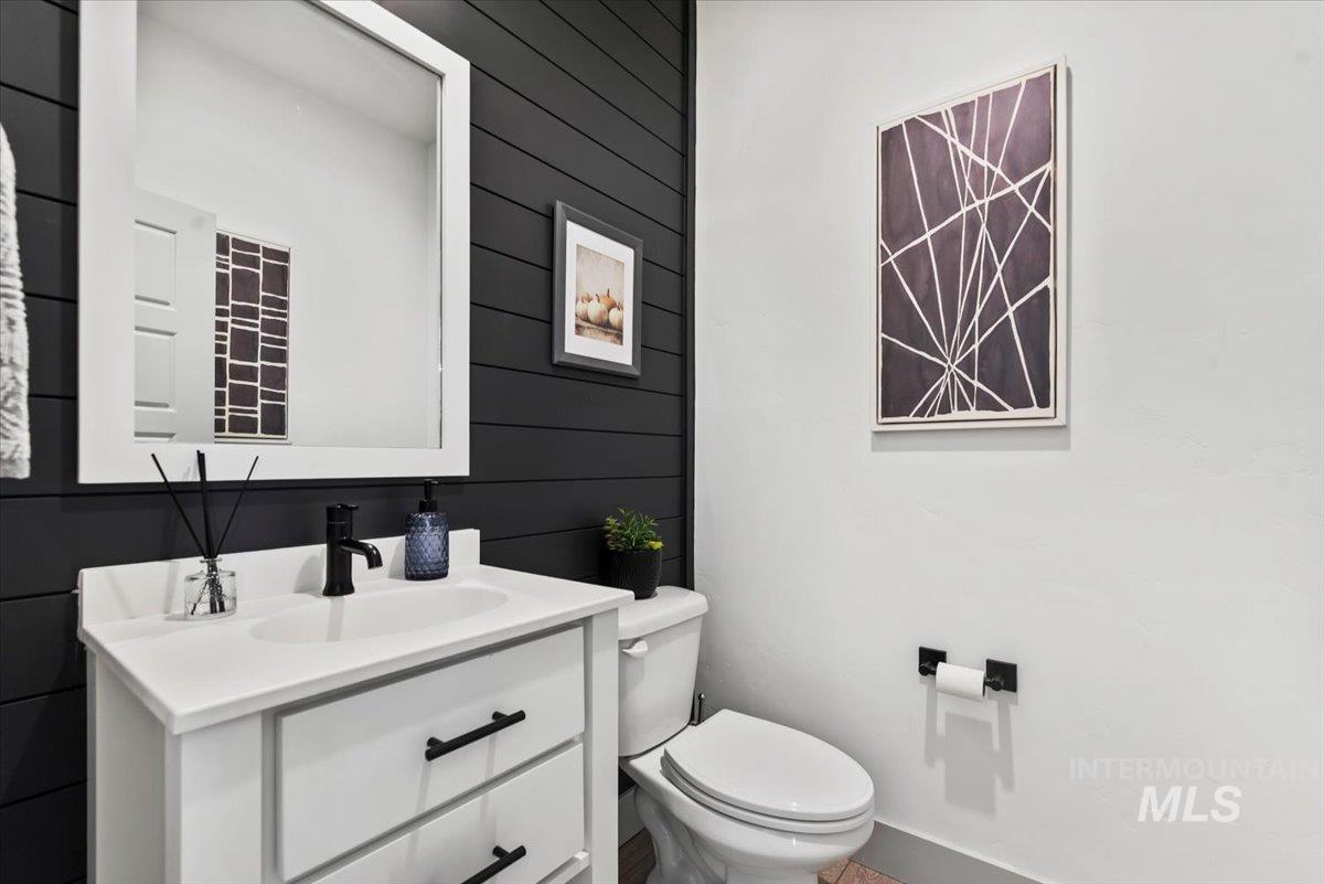 Half bath with vanity and toilet