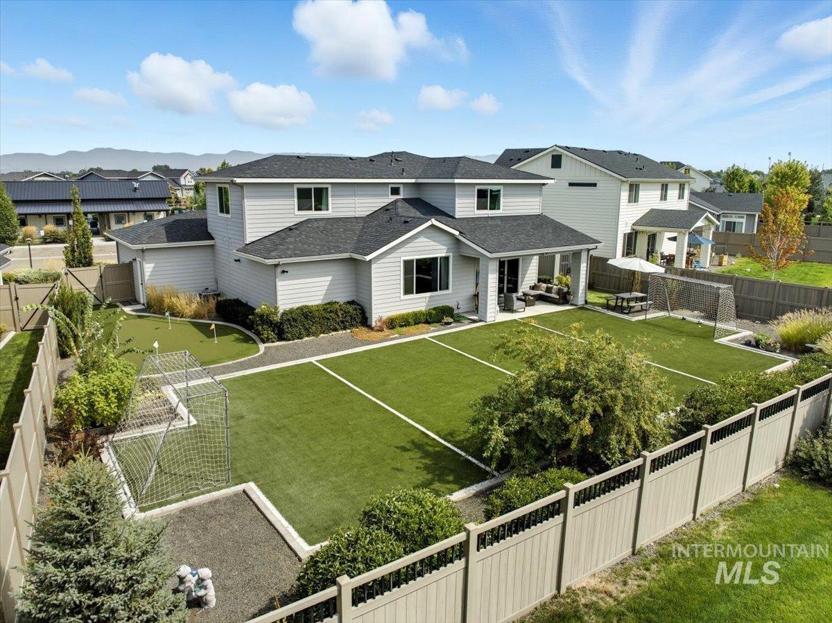 View of home's community with a residential view, a fenced backyard, and an outdoor hangout area