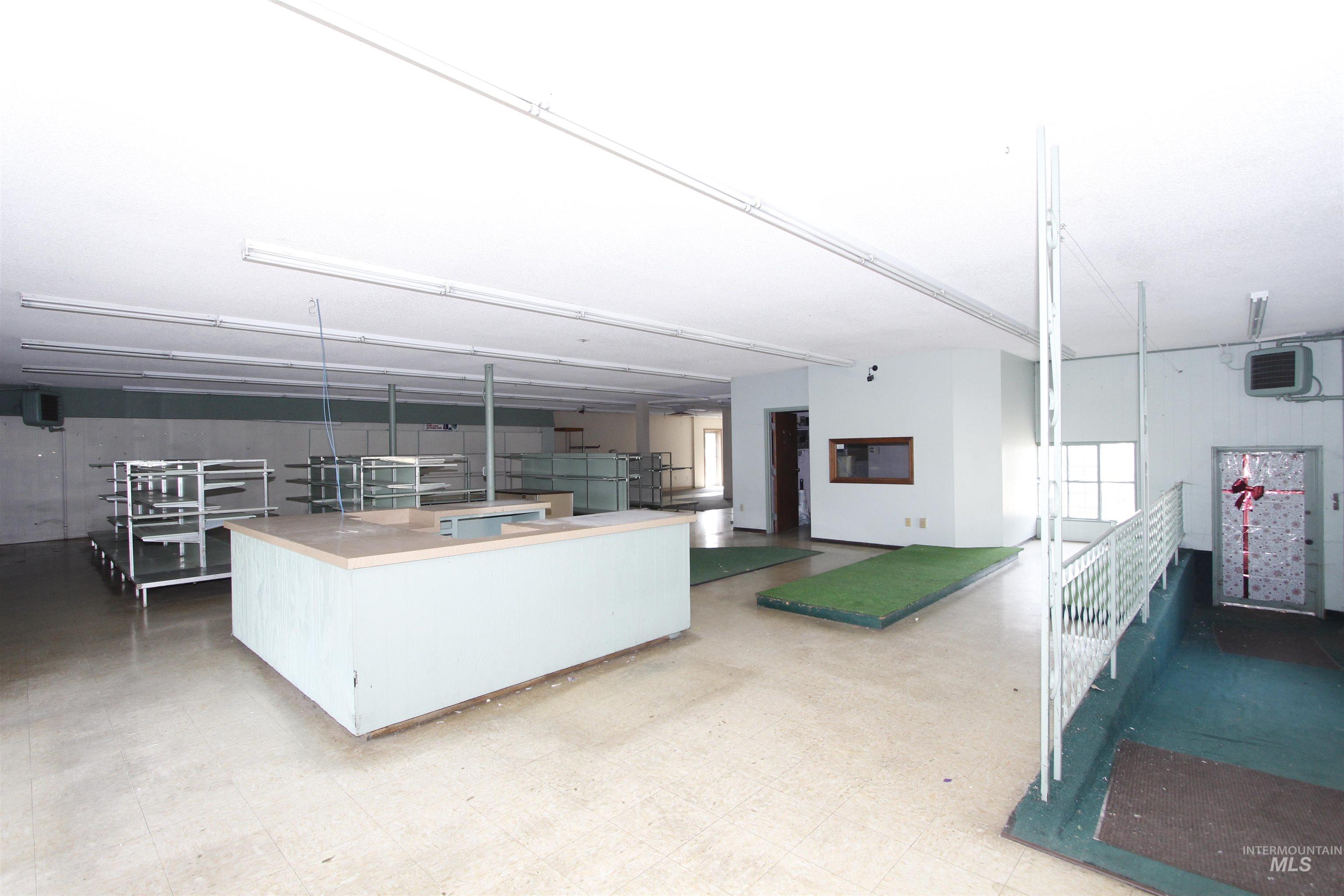 Kitchen with light flooring, a kitchen island, and a heating unit