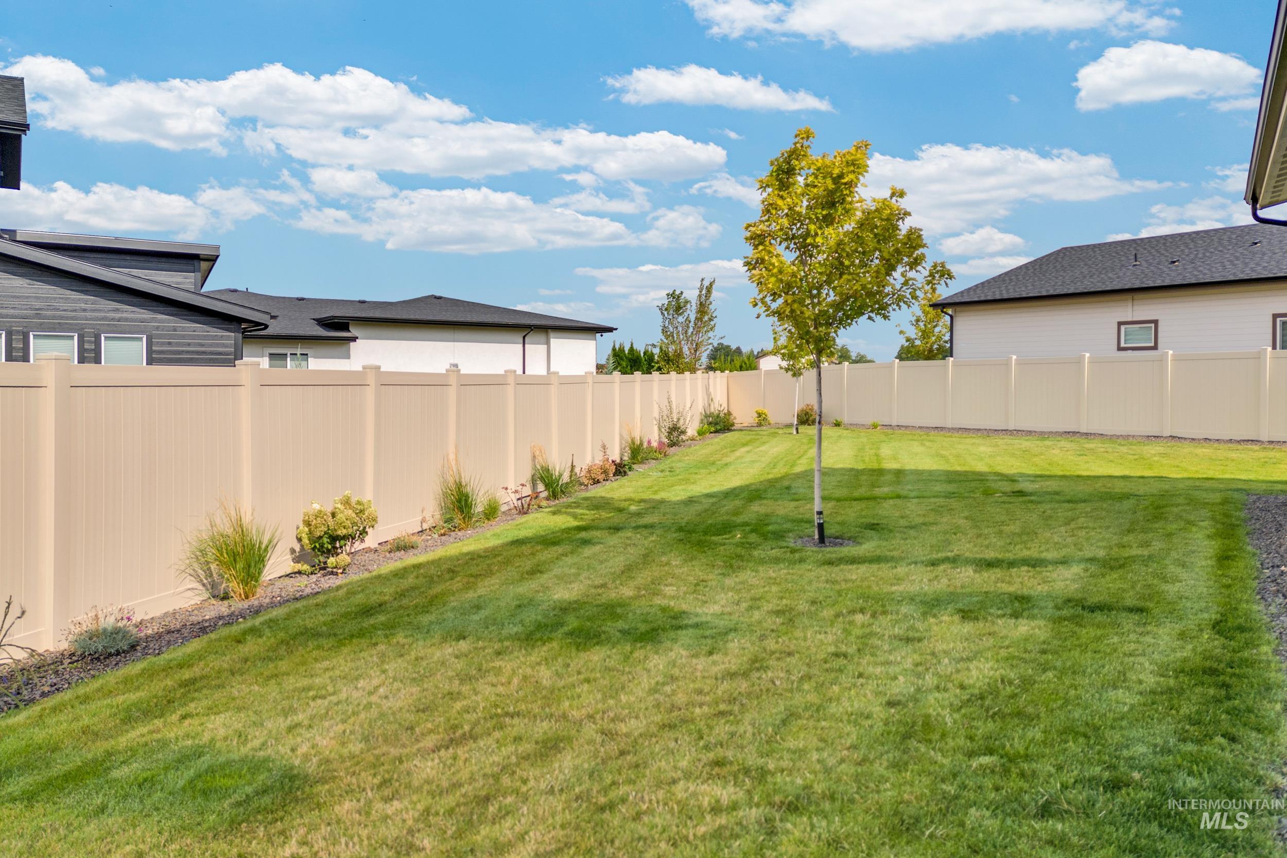 View of fenced backyard