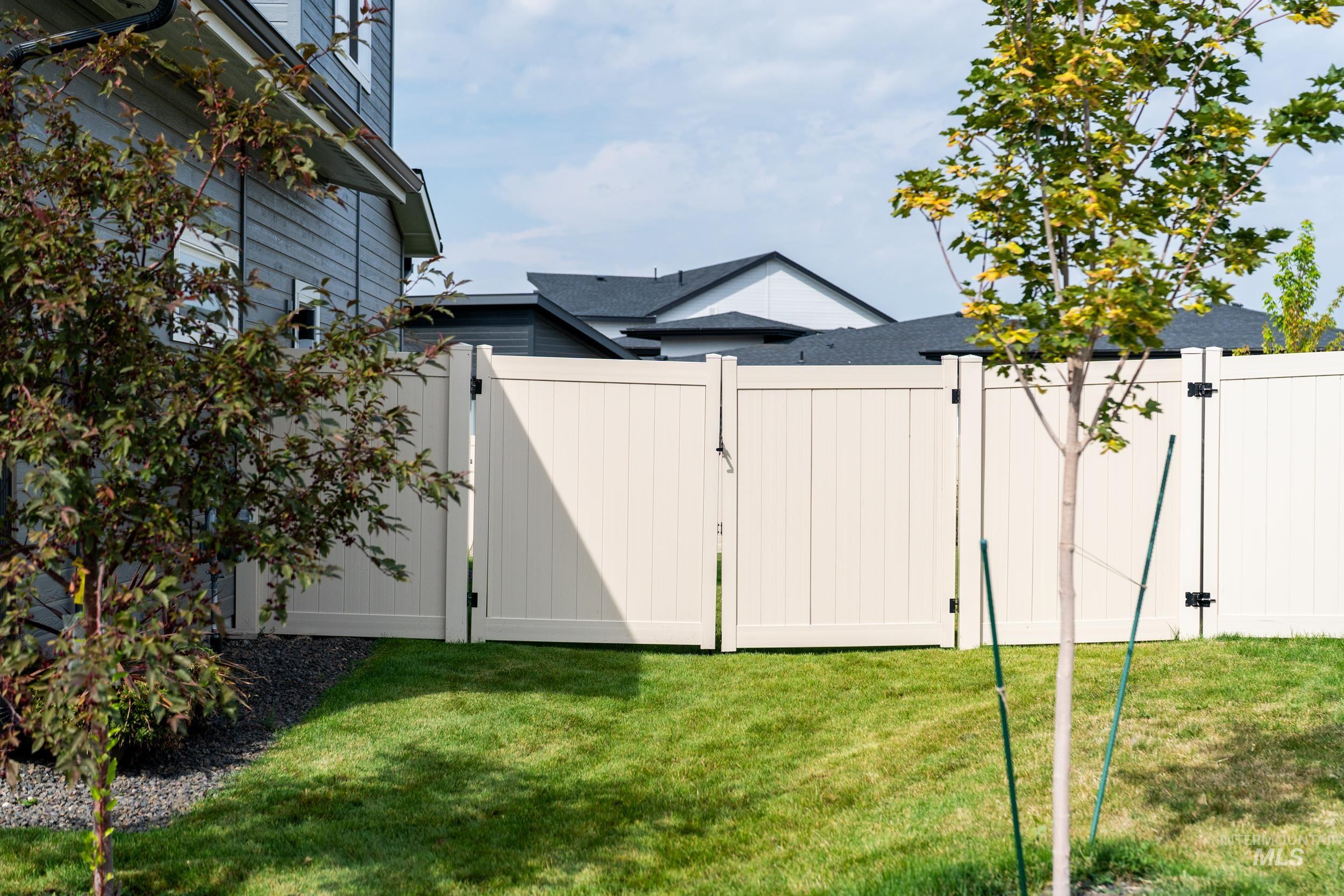View of yard with a gate