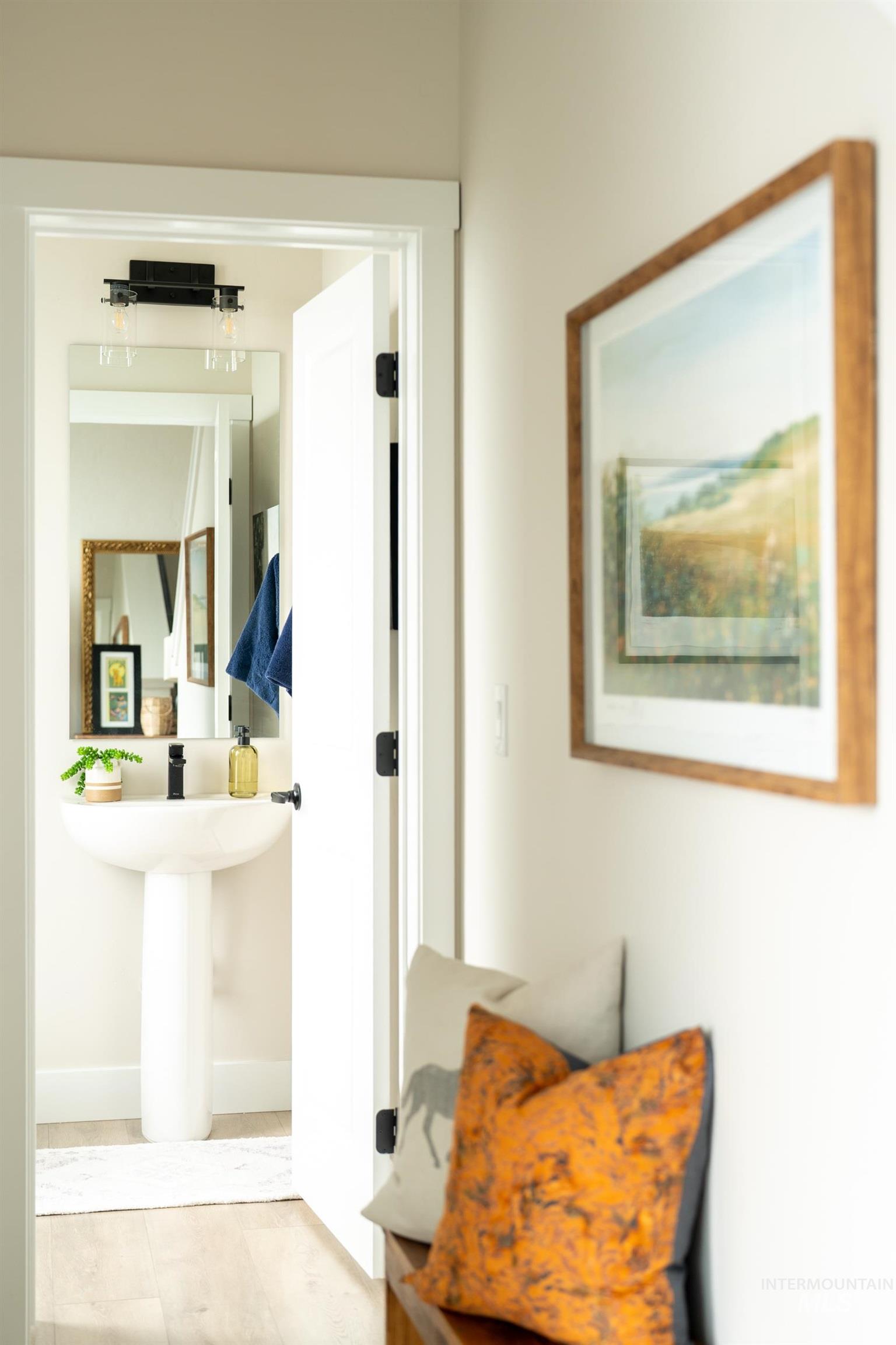 Hallway featuring tile patterned floors