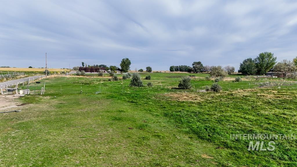View of yard with a rural view