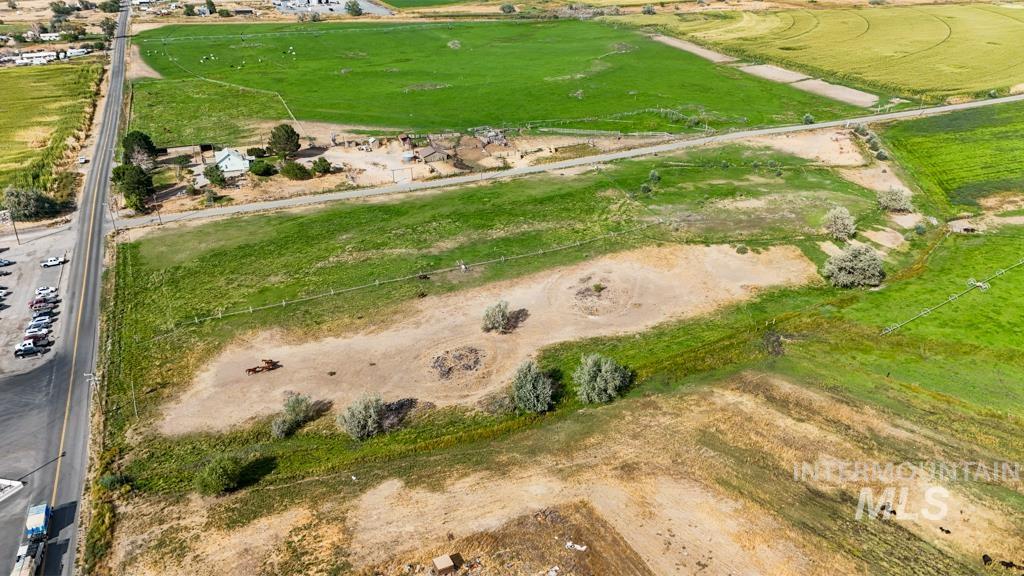 Aerial view of property and surrounding area with rural landscape
