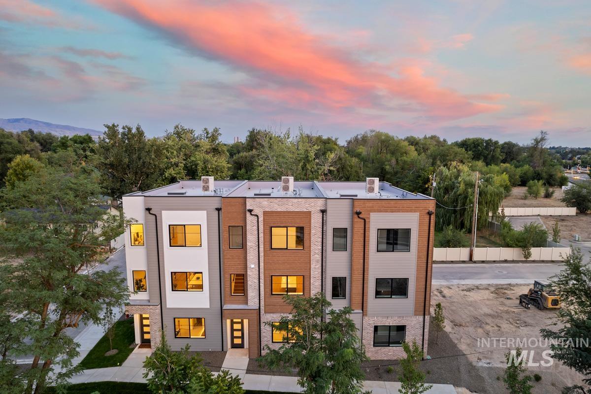 View of property at dusk