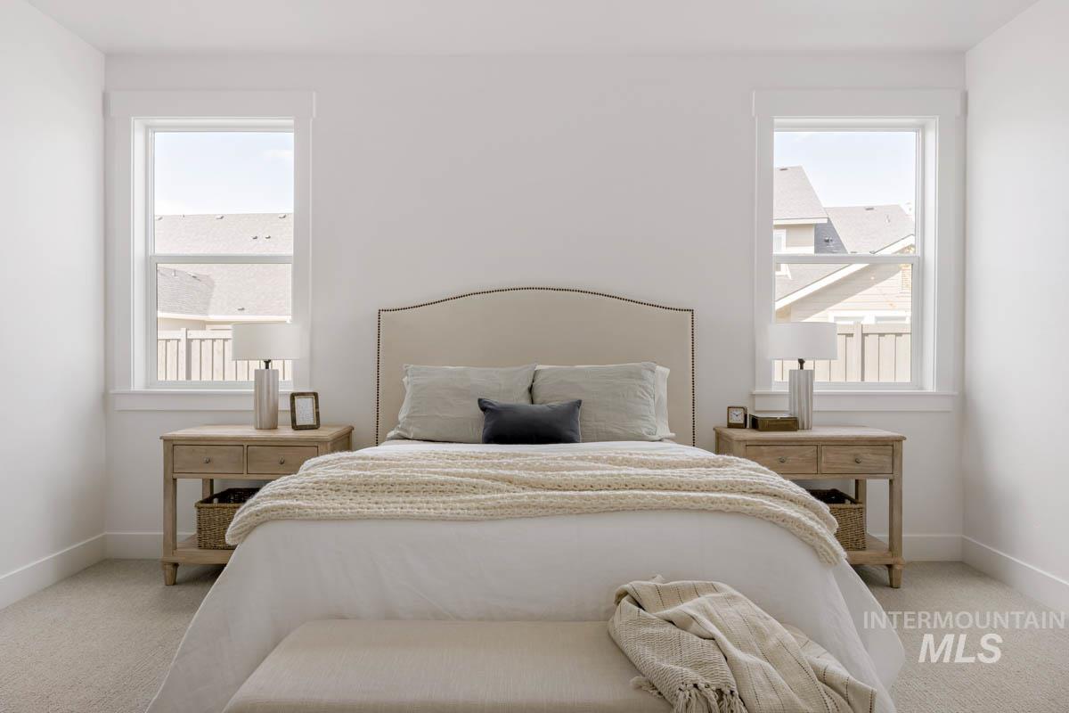 Bedroom with light carpet