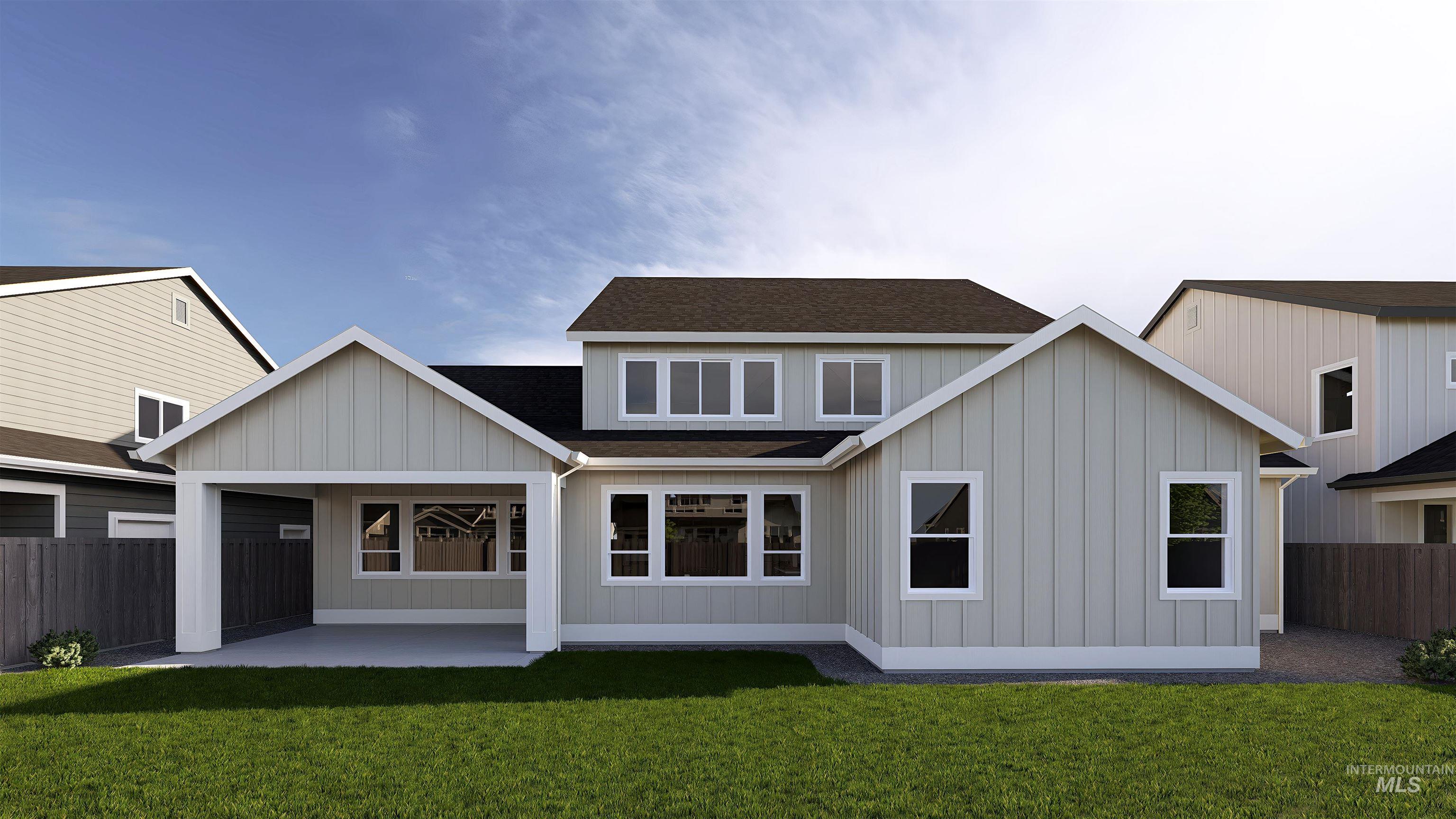 Back of property featuring roof with shingles, a patio, and board and batten siding