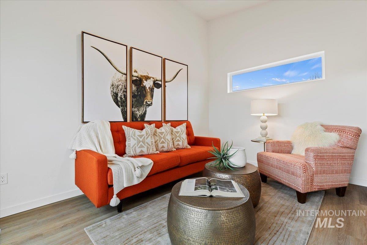 Living room featuring baseboards and wood finished floors