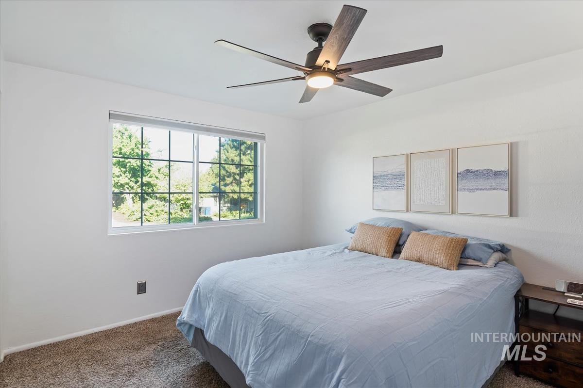 Bedroom featuring carpet and a ceiling fan