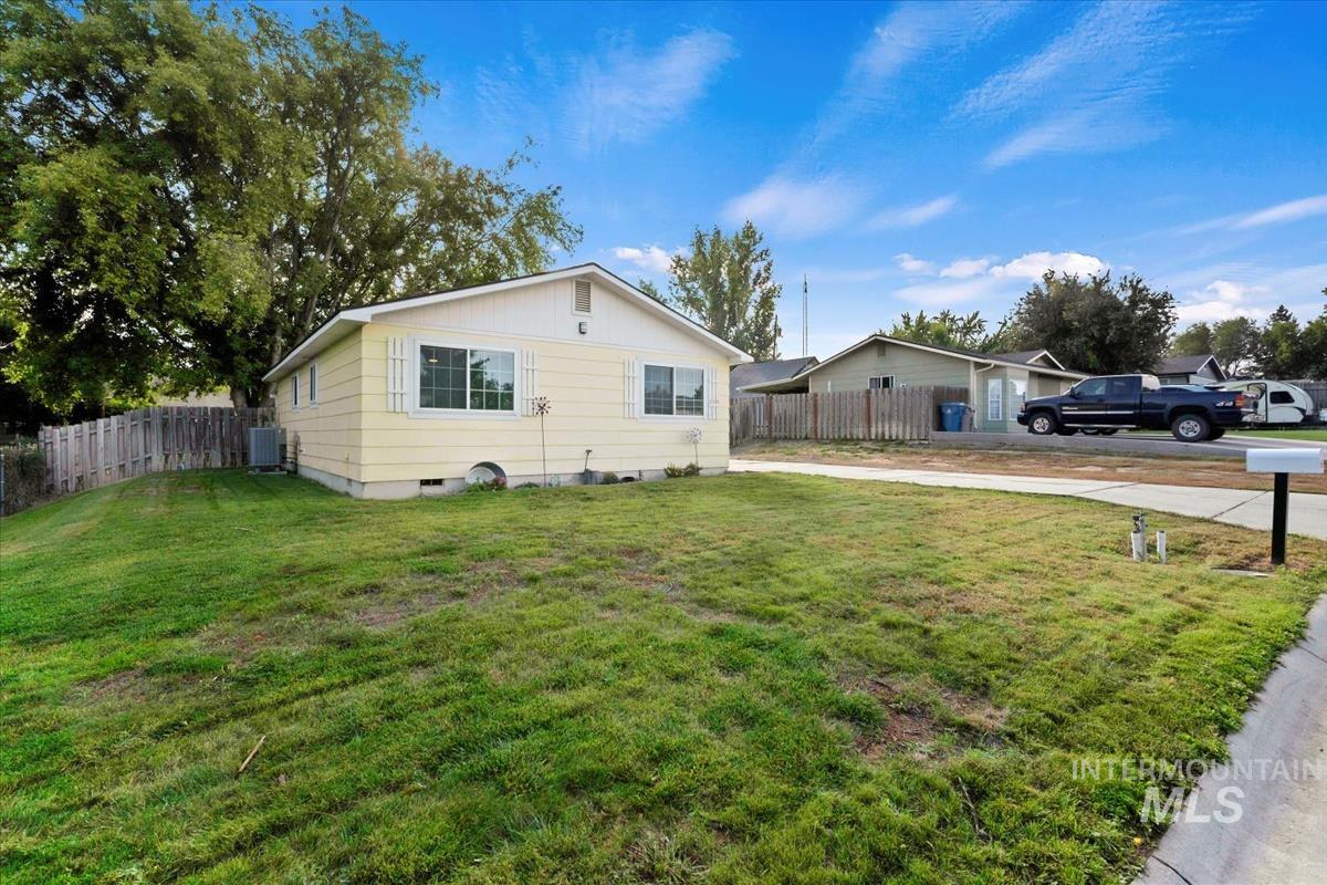 View of home's exterior with crawl space and a cooling unit