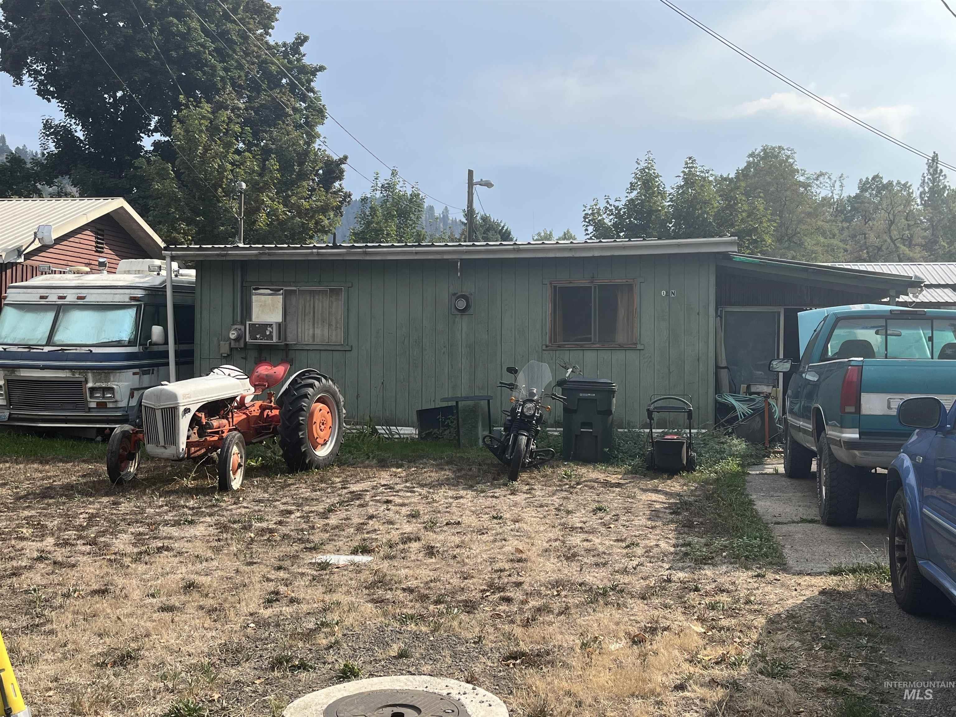 View of front of house featuring cooling unit
