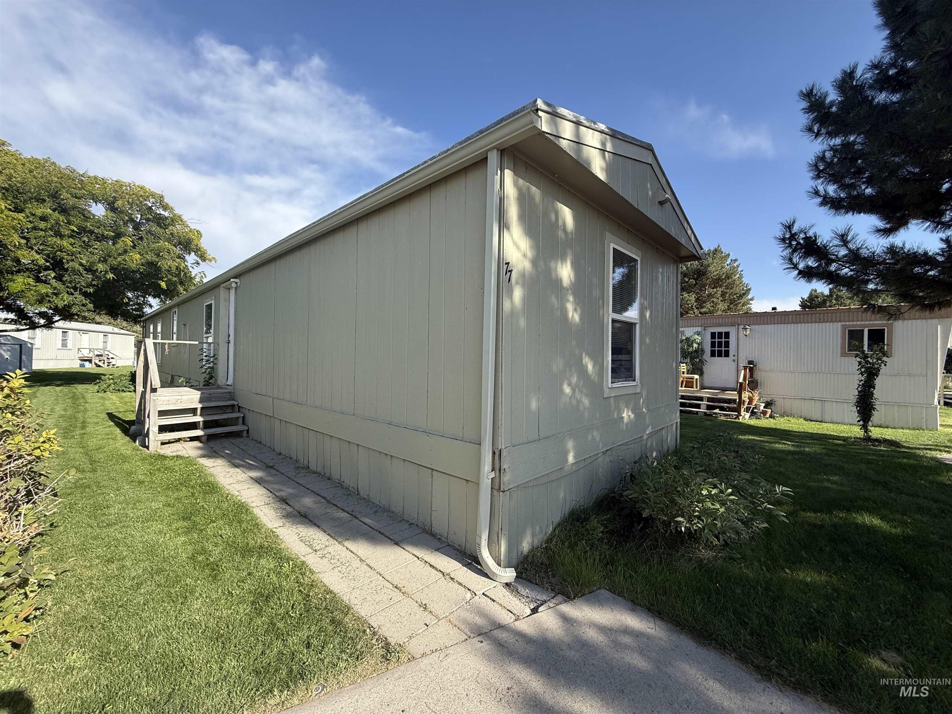 View of home's exterior featuring a yard