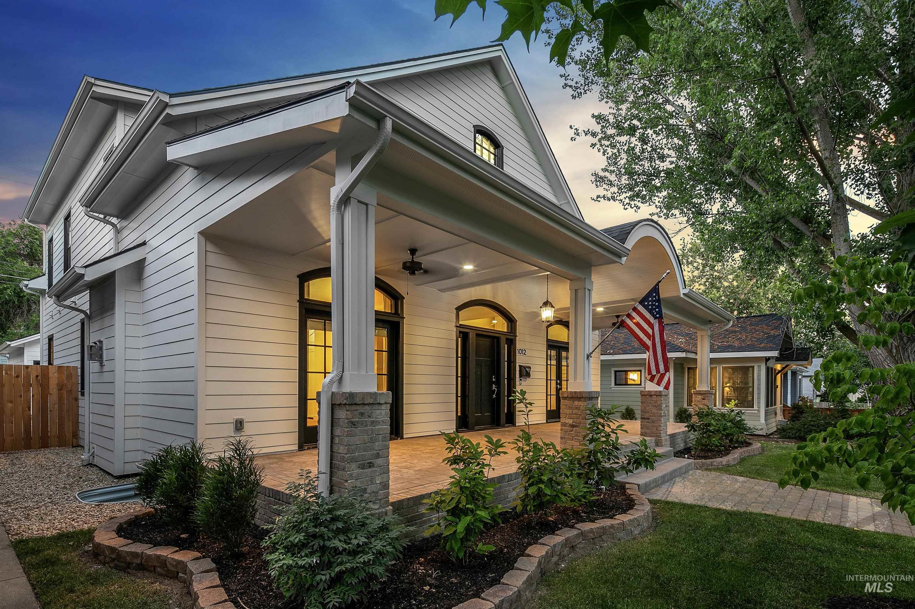 View of front of home with a porch and a ceiling fan