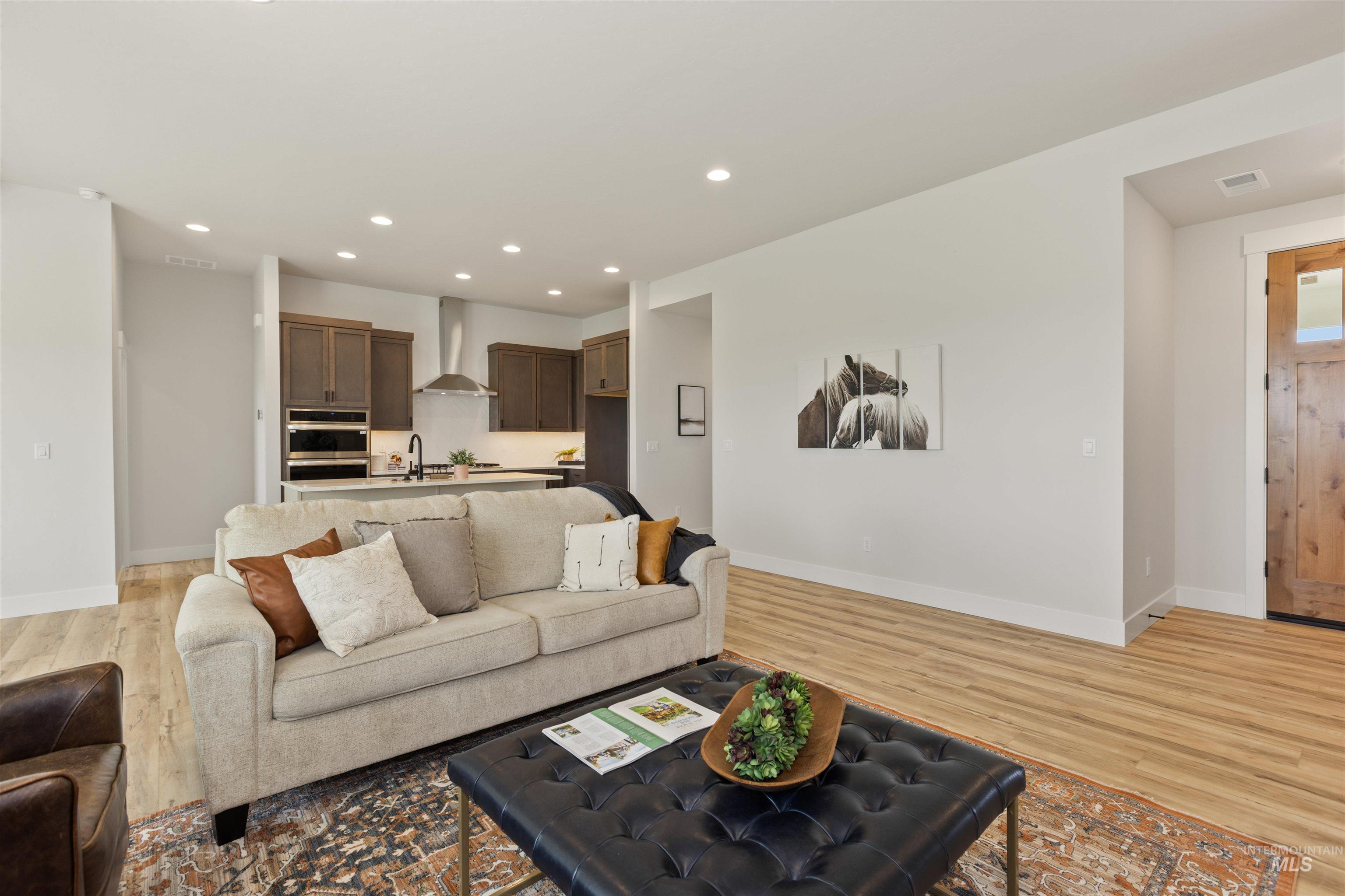 Living room featuring recessed lighting and light wood finished floors