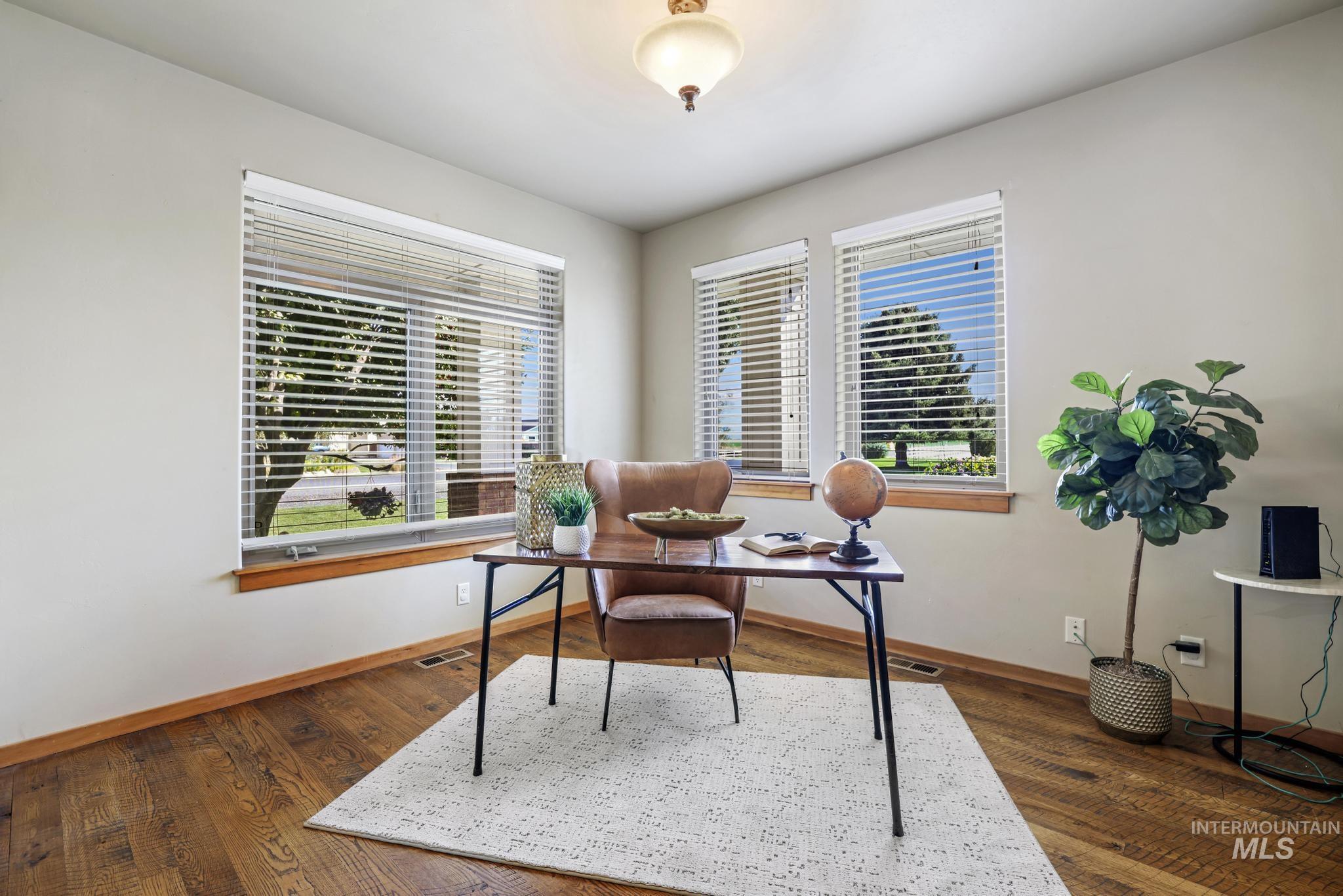 Office space featuring dark wood finished floors
