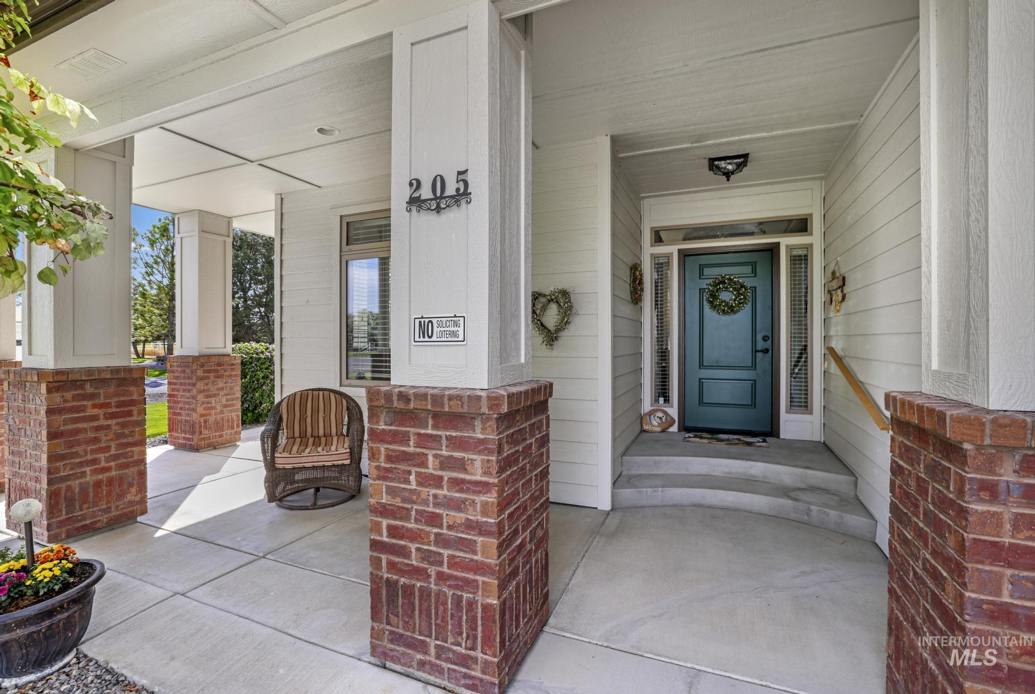 Doorway to property with covered porch