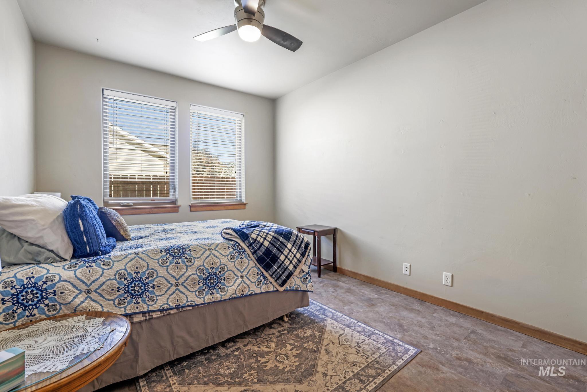 Bedroom featuring baseboards and ceiling fan