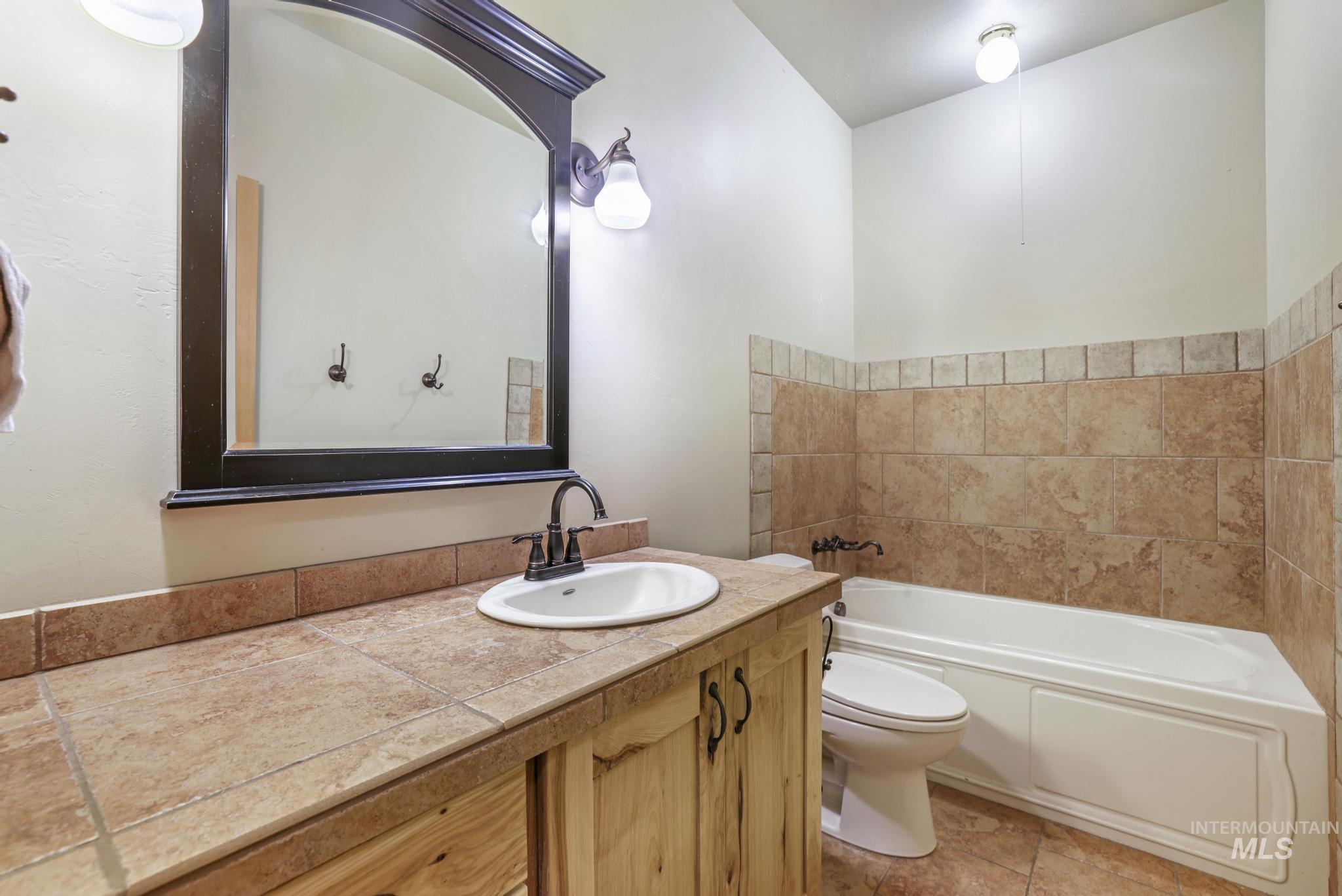 Bathroom featuring vanity and light tile patterned floors
