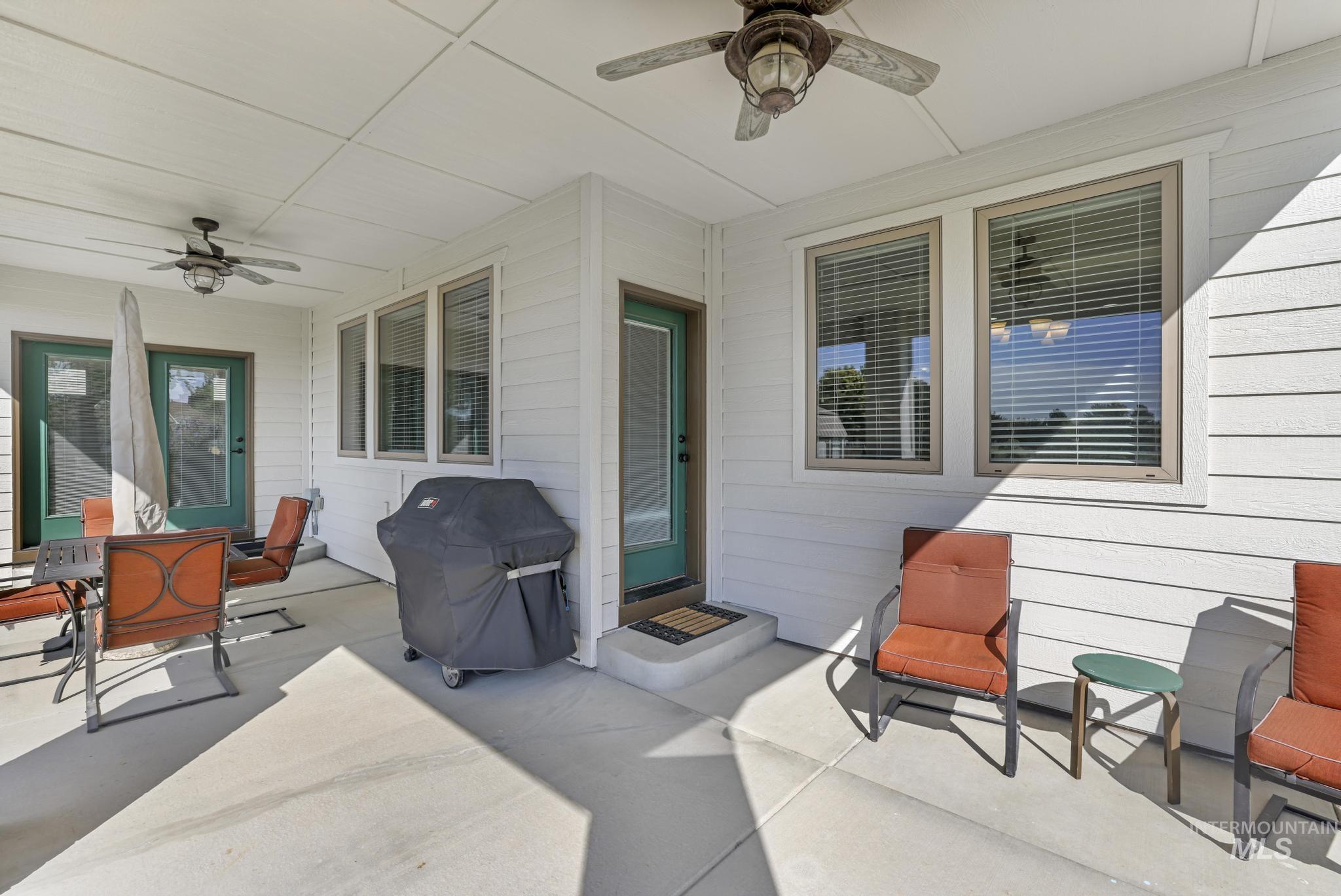 View of patio / terrace with ceiling fan and a grill