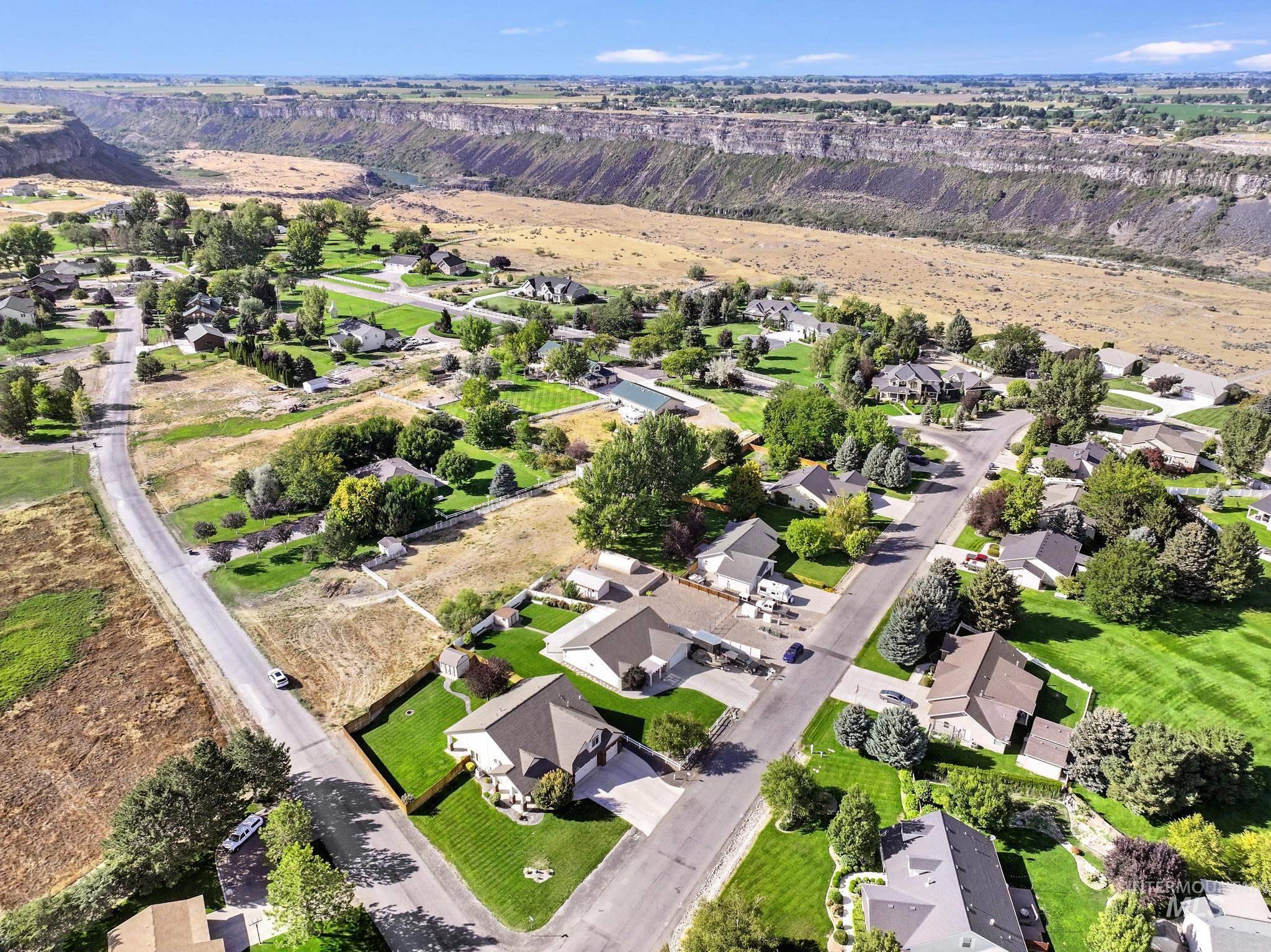 Aerial view of property's location featuring nearby suburban area