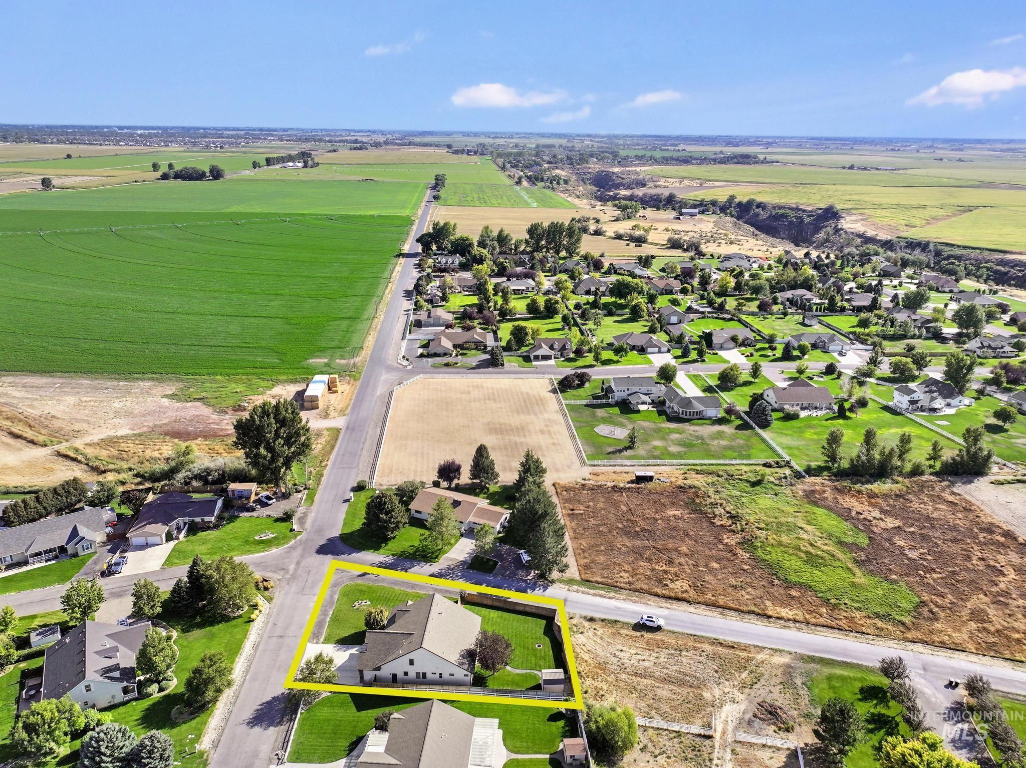 View of rural area with nearby suburban area and property parcel outlined
