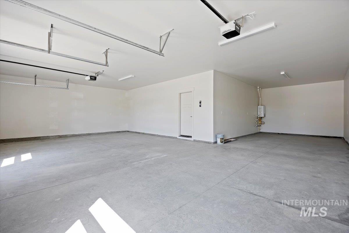 Garage featuring a garage door opener