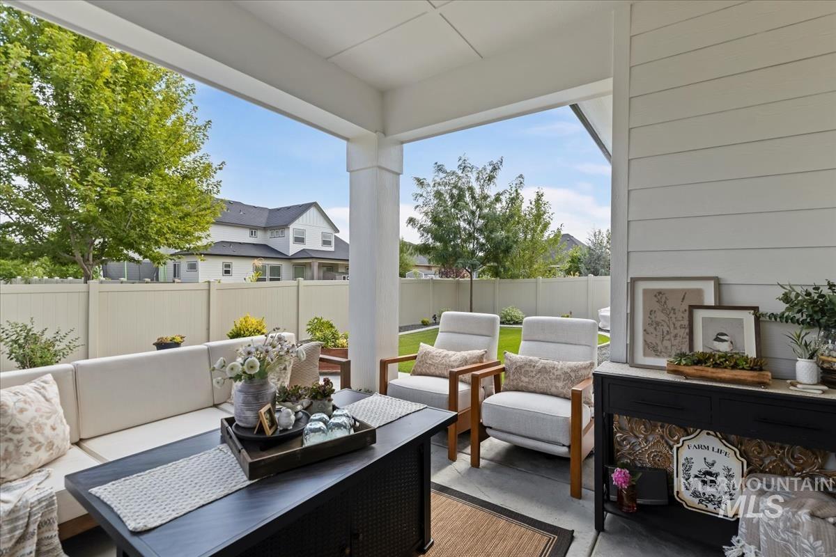 Fenced backyard featuring outdoor lounge area and a patio